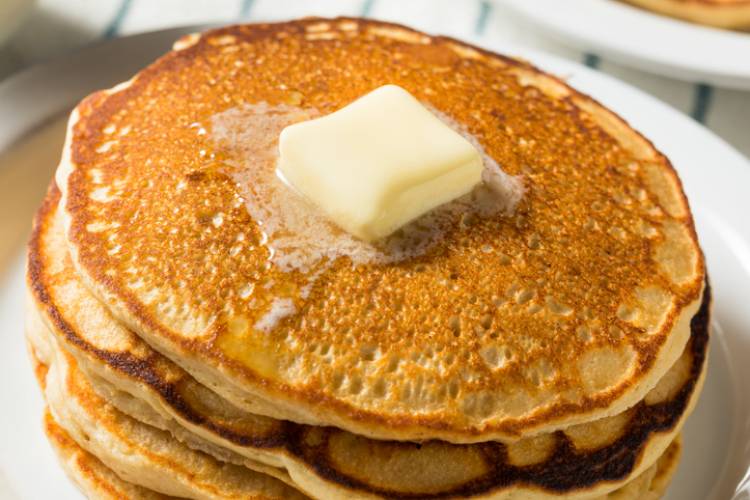 homemade warm buttermilk pancakes with butter and syrup