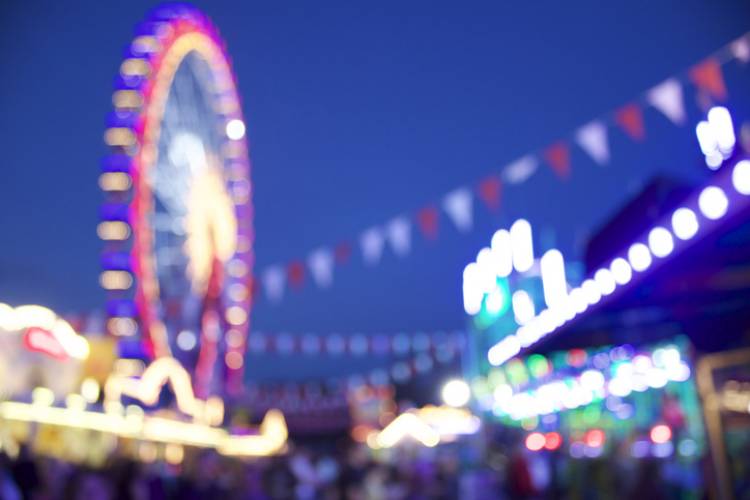 Here you can see a defocused carnival scene with a ferris wheel in the backround